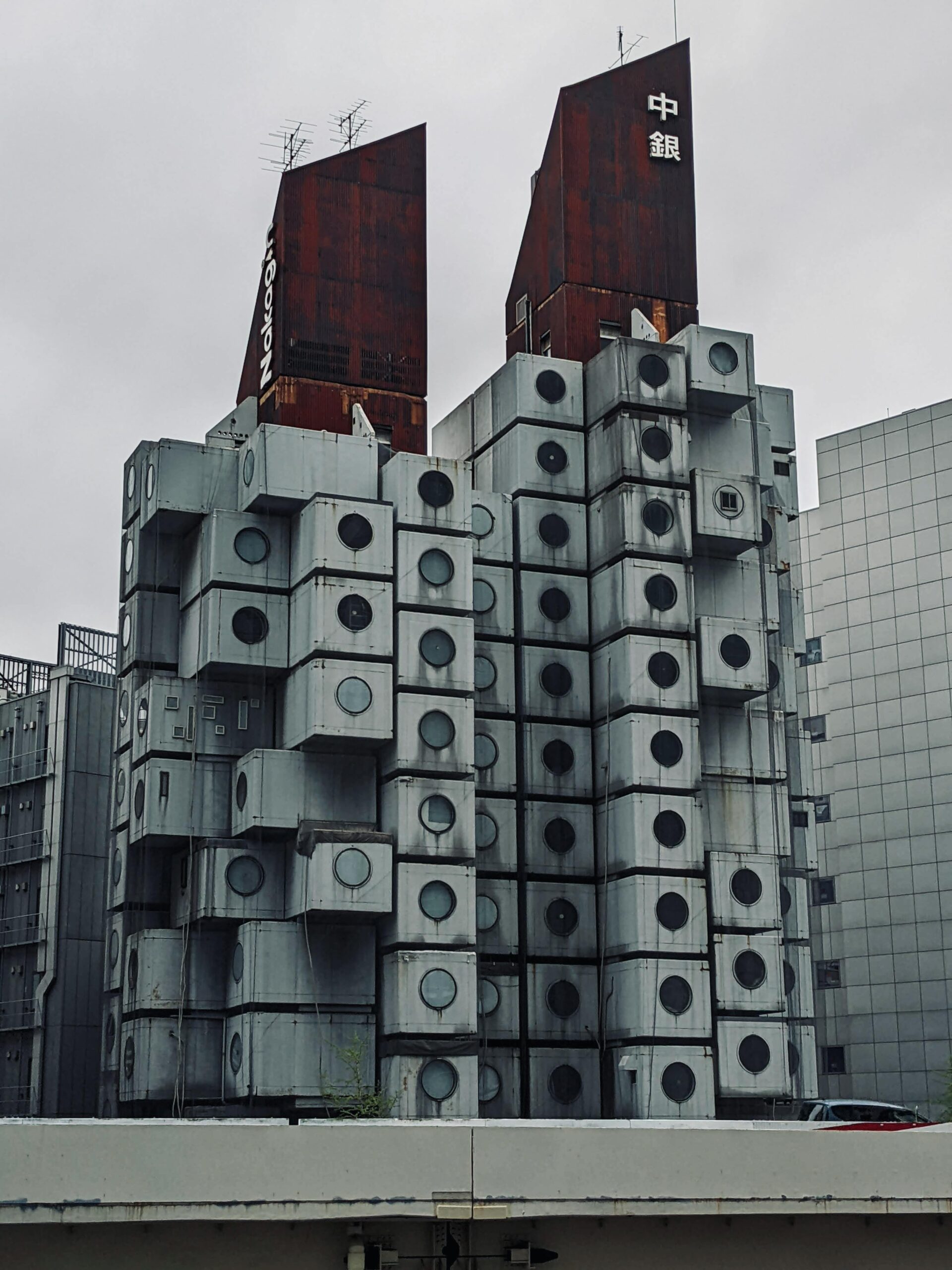 Explore the iconic Nakagin Capsule Tower in Tokyo, a symbol of futuristic architecture and urban living.